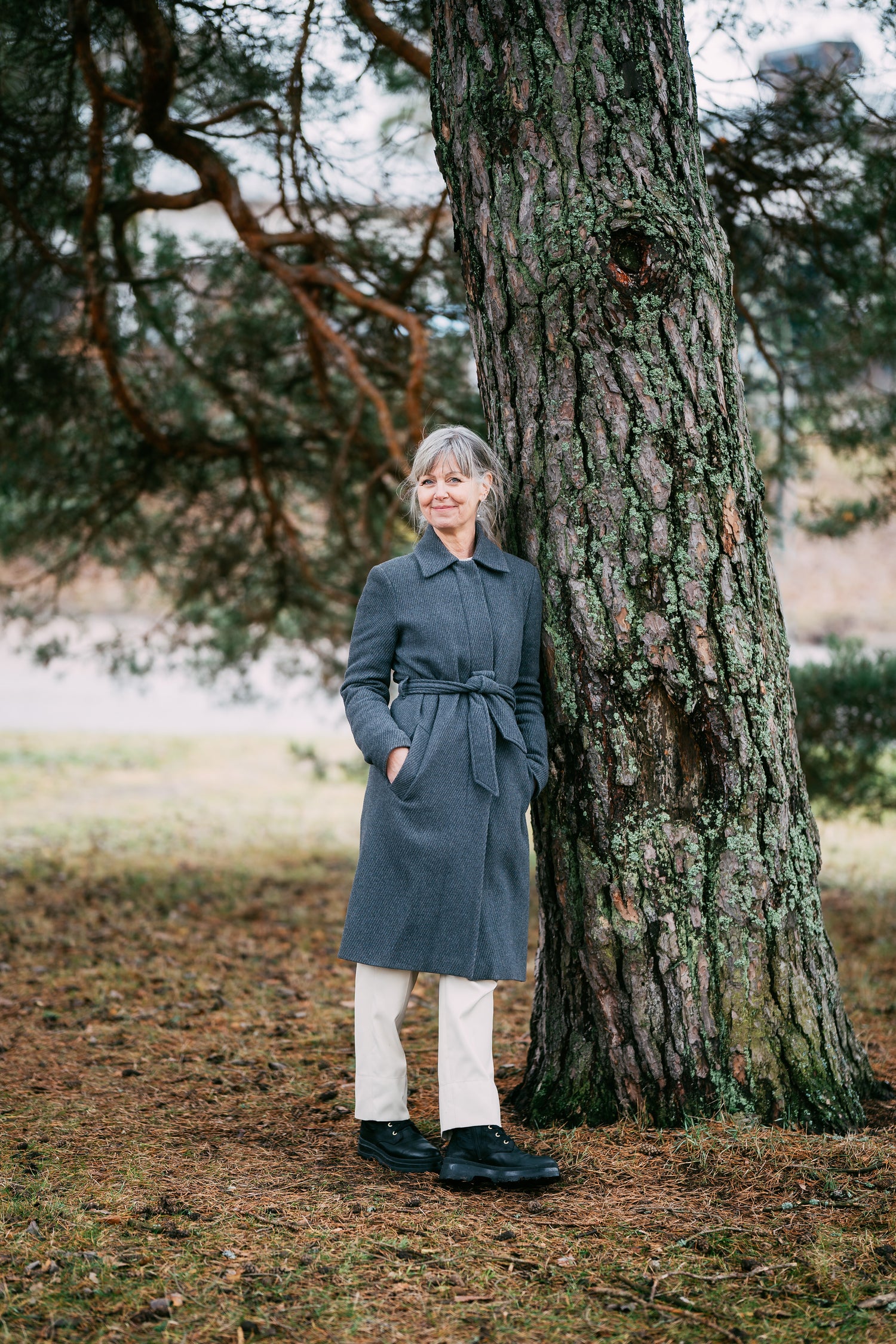 women standing lying with tree