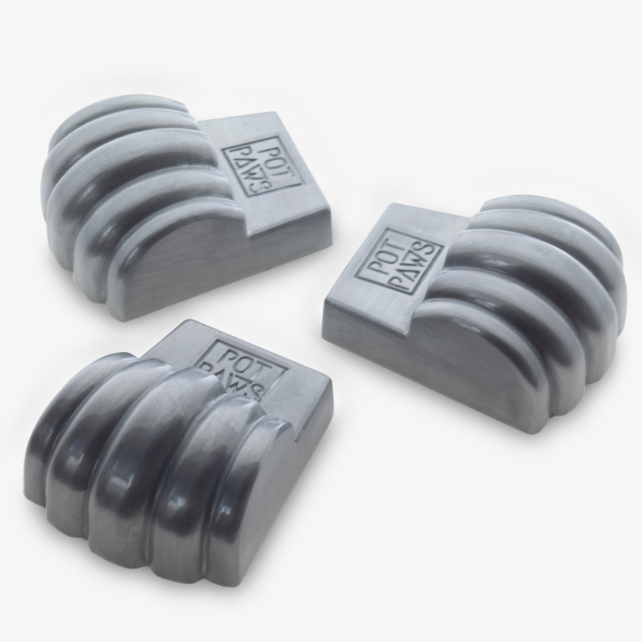paw-shaped pet bowl weights with engraved POT PAWS logo