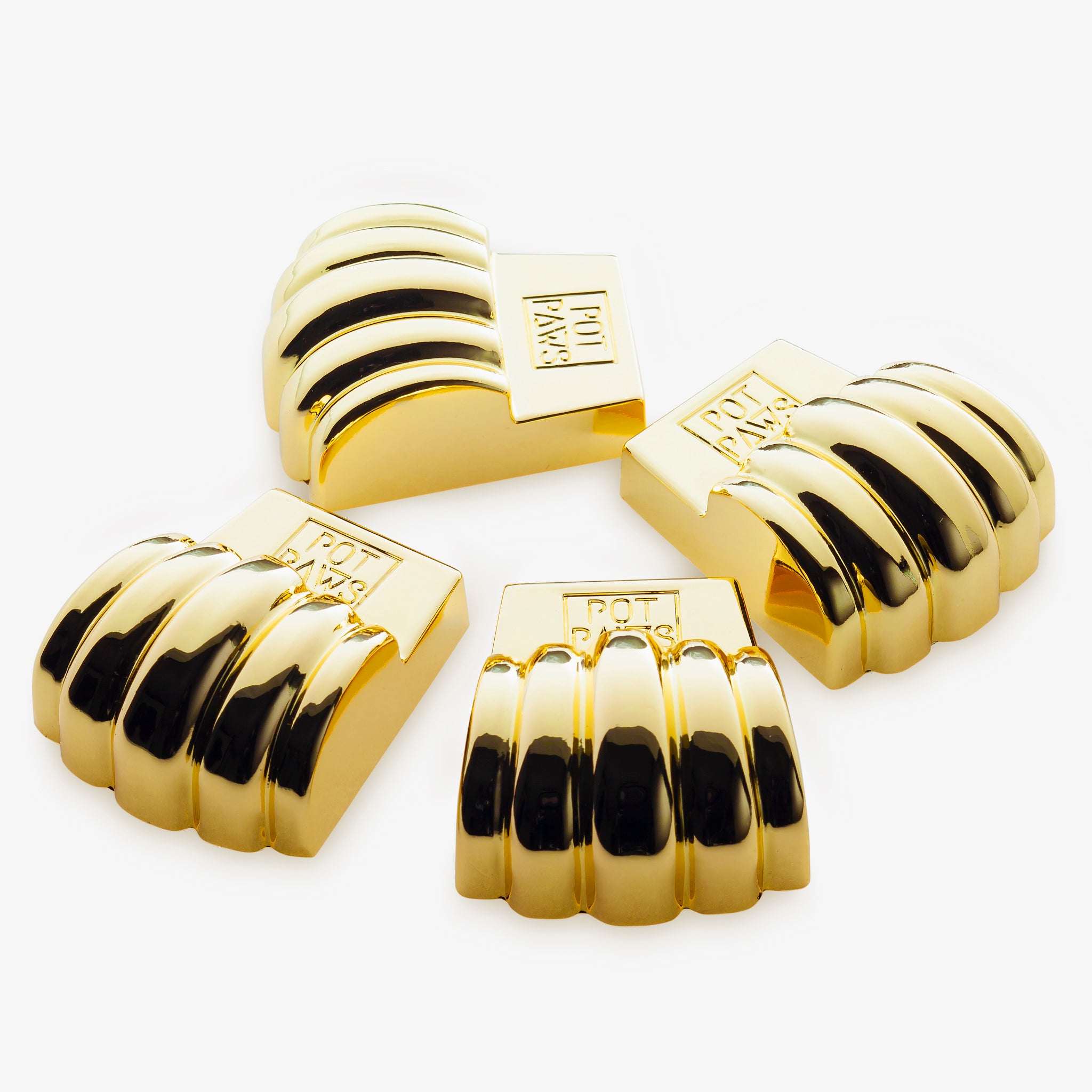 Gold paw-shaped pet bowl weights with engraved POT PAWS logo